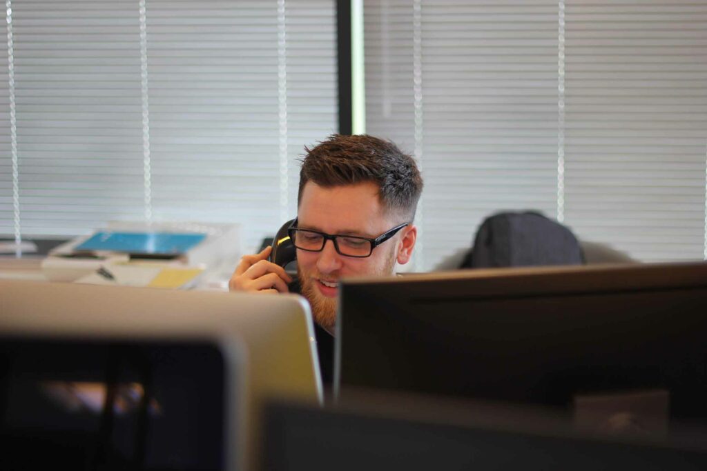 man on a call in an office