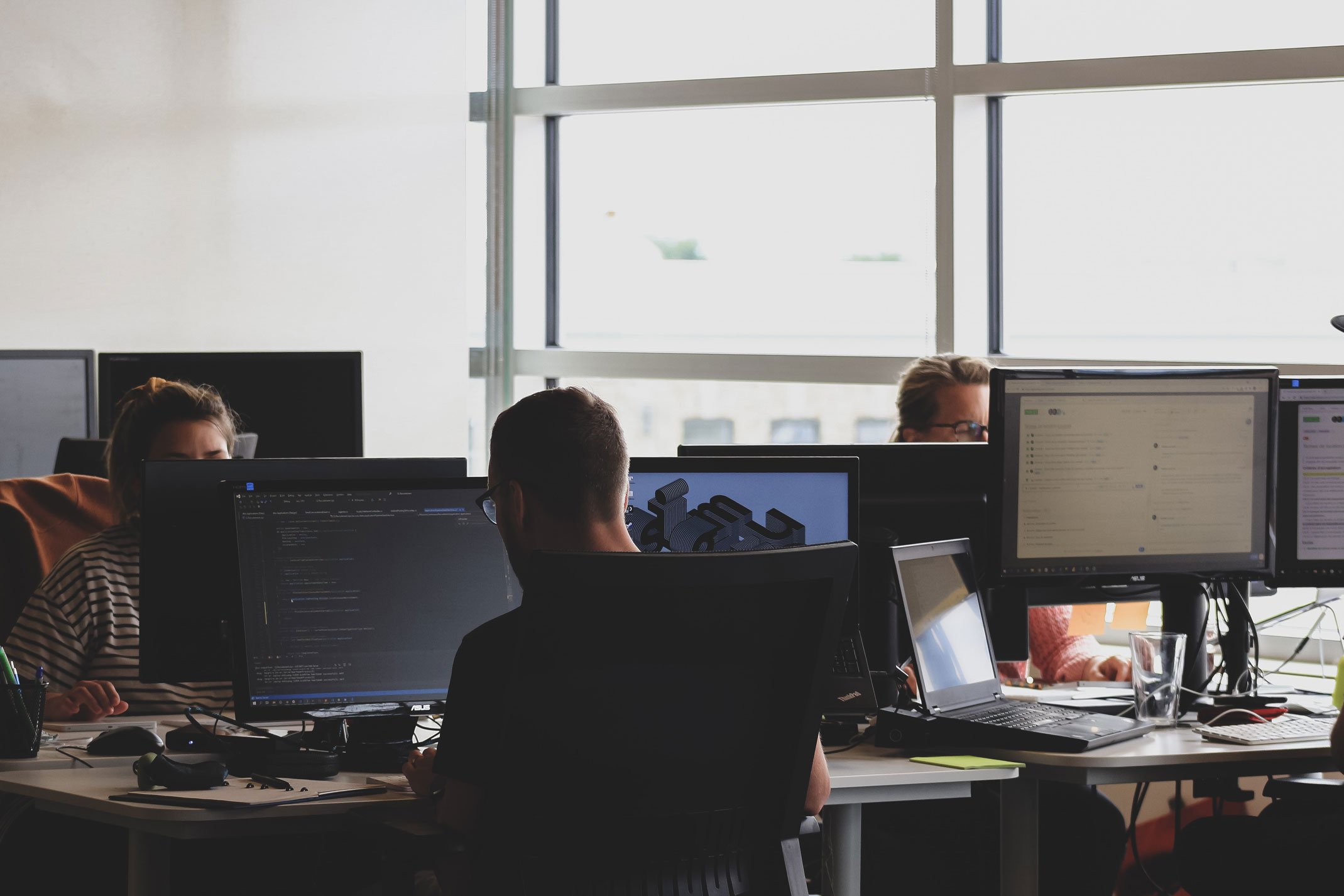 people in an office working on computers