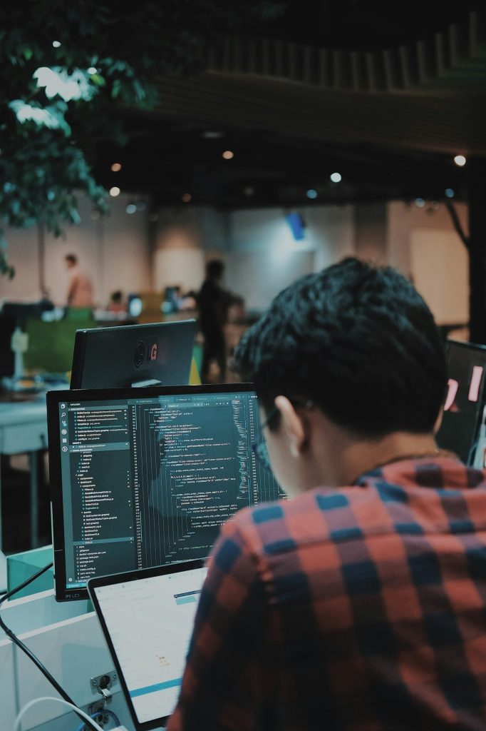man using a computer at a desk