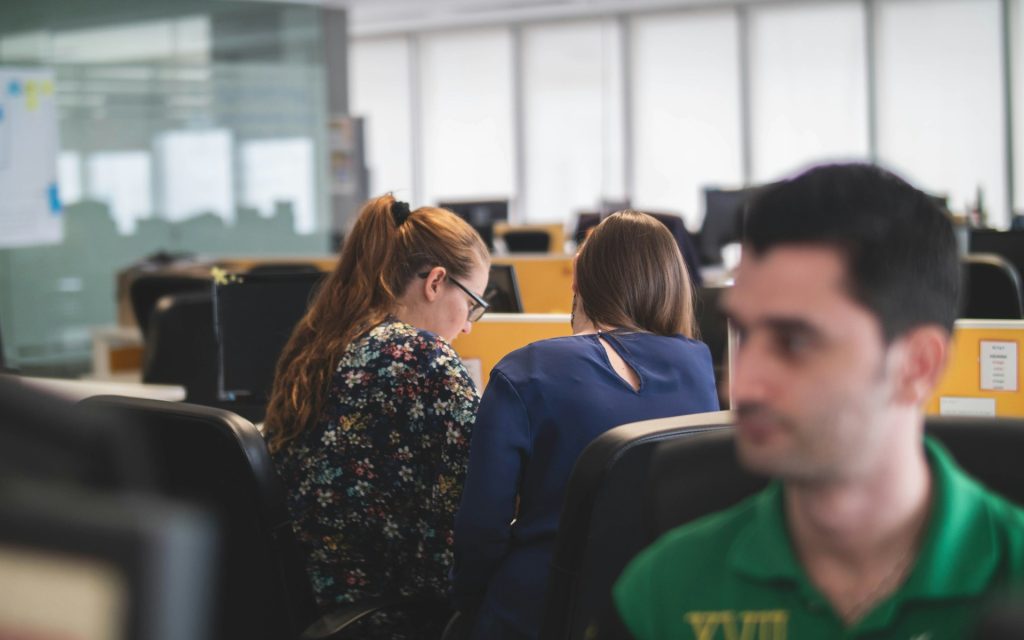 people in an office working on computers