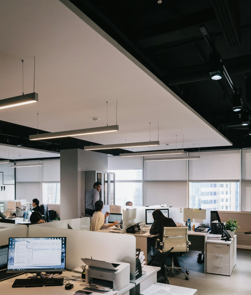 people in an office at their desks