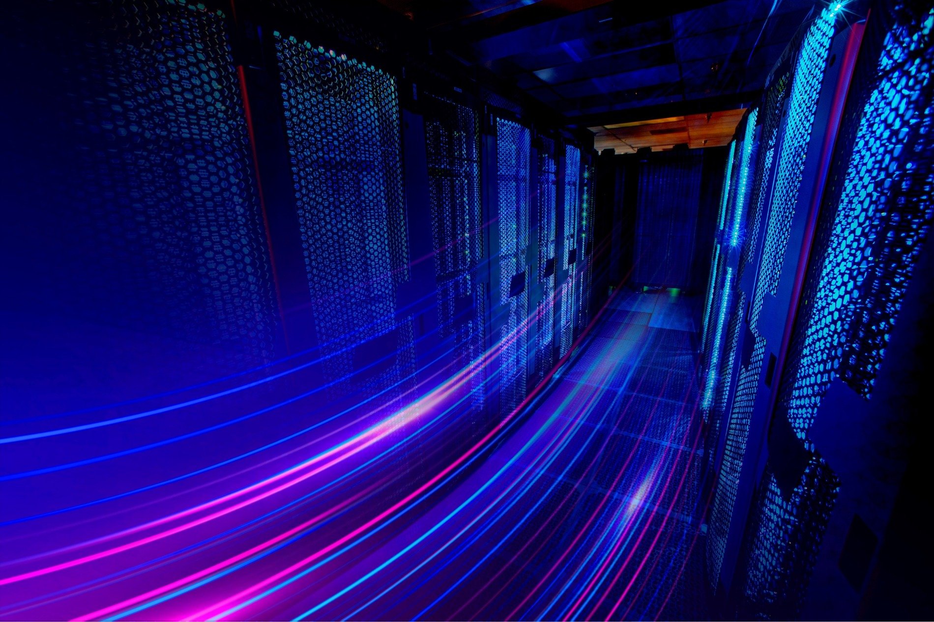 a neon blue and purple server room